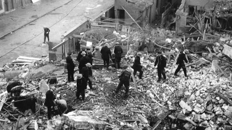 Overview of the Old Palace School after the bombing in 1941. Crews are working through the wreckage and debris caused