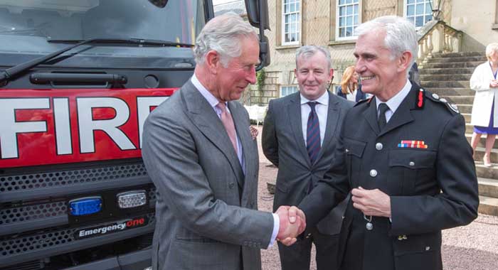 Previous Commissioner Ron Dobson shaking hands with HRH Prince Charles 