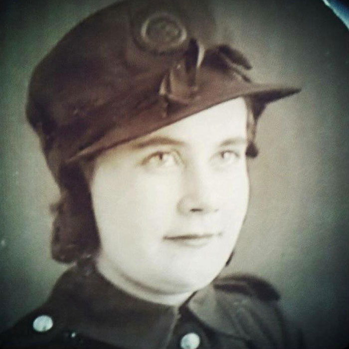 Black and white photograph of Firefighter Maisie Beth Spooner in her uniform