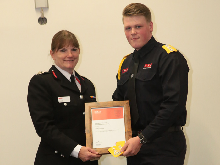 Dany Cotton giving a cadet his certificate