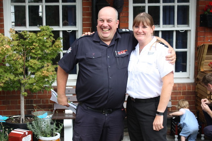 Green Watch Manager, Mat Rosendale and London Fire Commissioner Dany Cotton smiling with their arms around each others shoulders