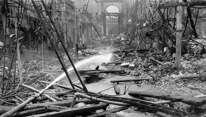 Black and white photograph of the Smithfield fire as it smoulders 