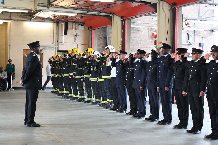 Les Bowman standing in front of Firefighters 