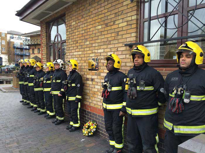 10 firefighters in PPE outside the modern Limehouse basin 