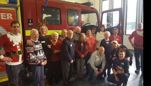 Firefighters welcome the local community into the fire station for Christmas lunch