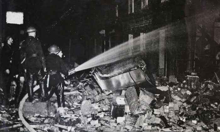 Historical photo of Firefighters extinguishing a fire 