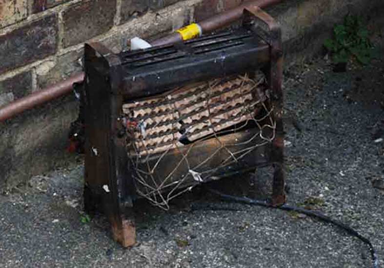 Burned out heater. This image highlights the danger of portable heaters in cold winter months.