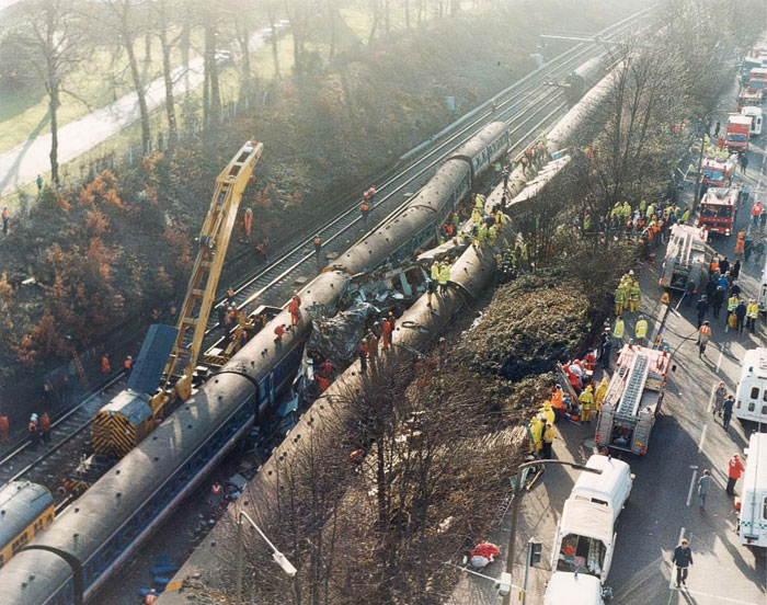 An aerial view of the crash site. A crane is helping to maneuver parts of the wreckage at the Clapham Junction rail crash in 1988