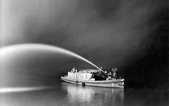 Fire boat doing maneuvers in the dark during World War 2
