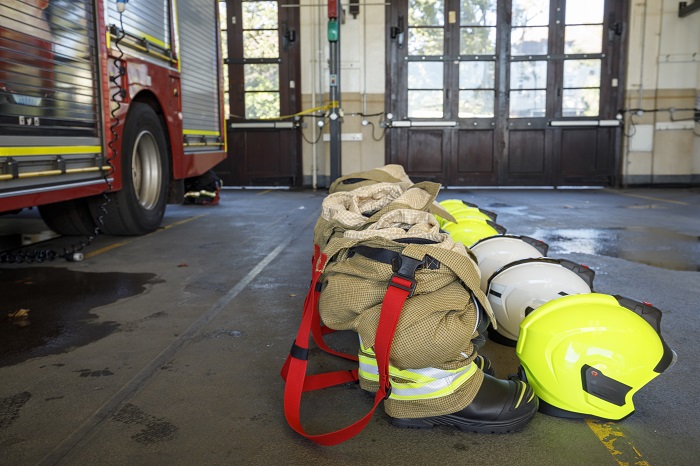 Firefighters leggings beside the fire engine