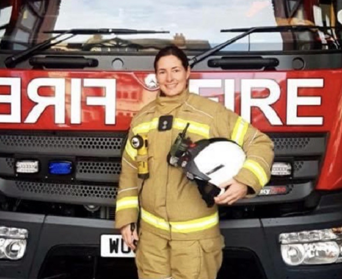 Kimberley Jerray-Silver standing in front of a fire engine