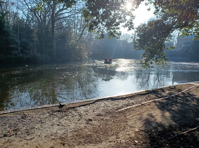 Firefighters in an inflatable rescue boat on a frozen lake