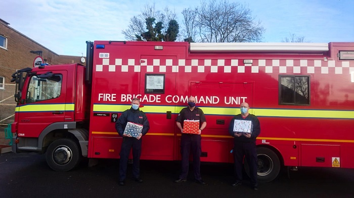 Lewisham crews standing in front of the Command Unit holding delivery boxes