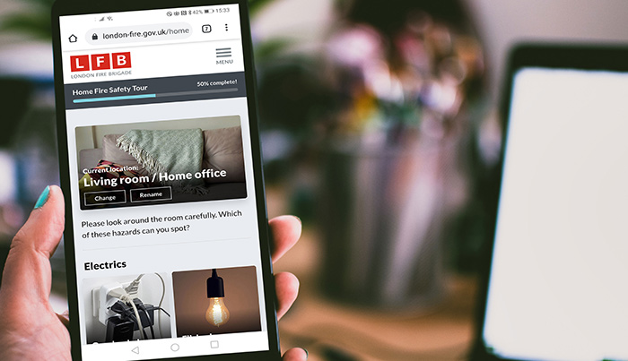 Person using the Home Fire Safety Checker on their smartphone.