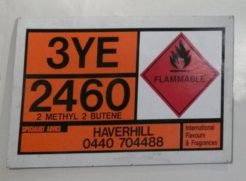 Hazchem sign showing a code, flammable symbol, and a phone number for specialist advice.