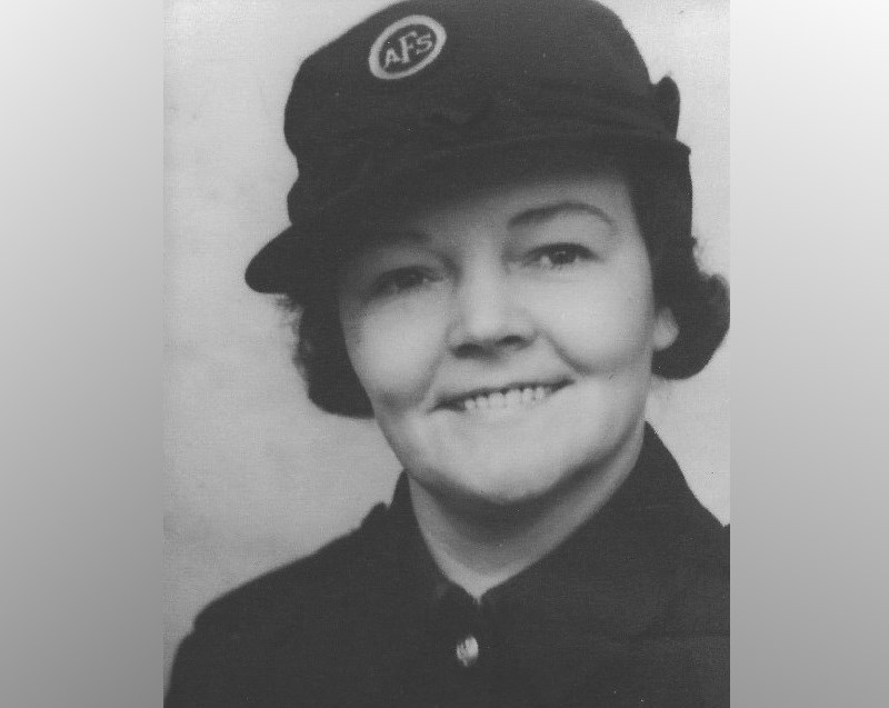 Portrait image of Auxiliary Fire Service Firewoman Winifred Alexandra Peters wearing her uniform