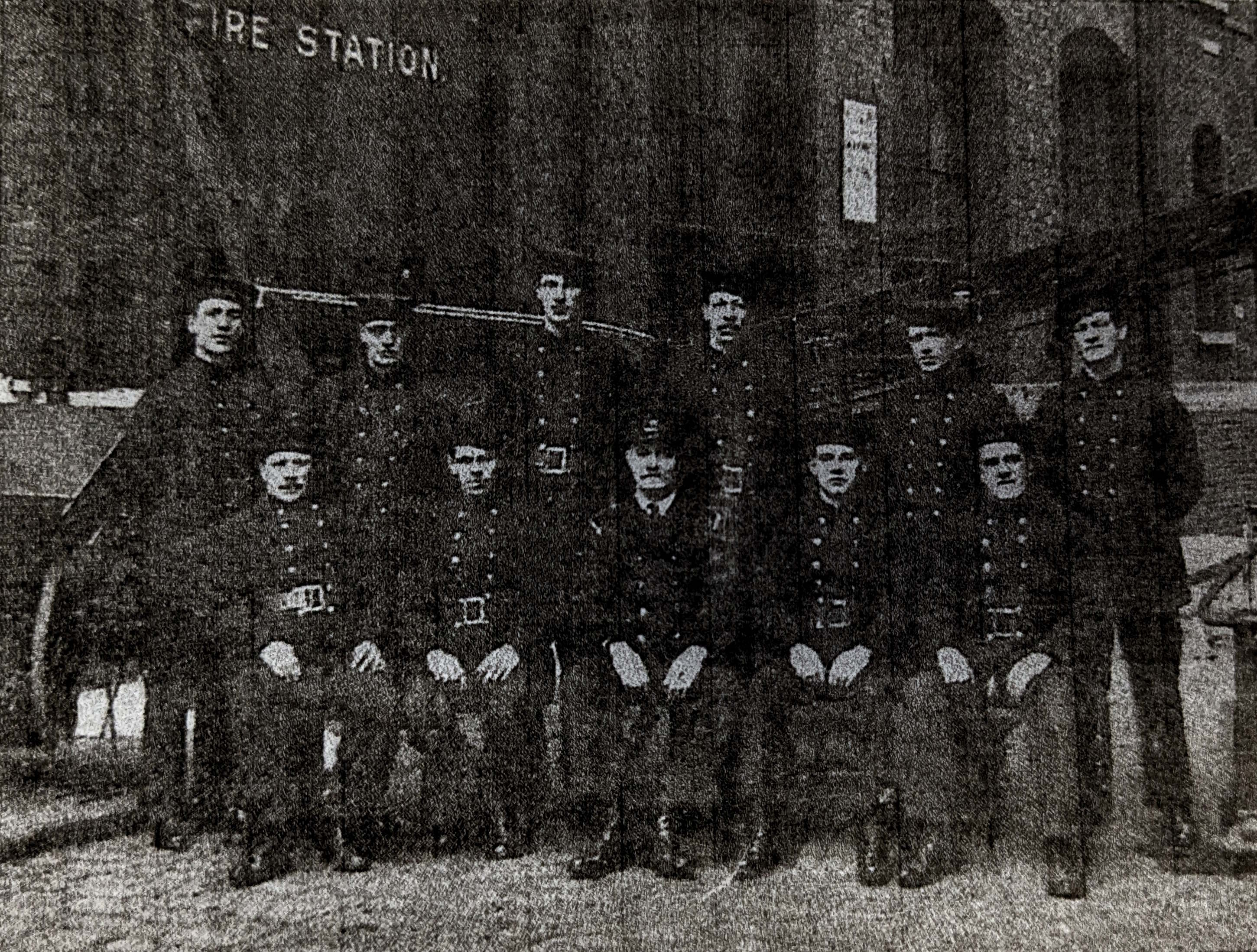 Firefighters from the Peek Frean Fire Brigade posed outside the fire station building at the Bermondsey site in 1922. The firefighters are wearing their uniforms.