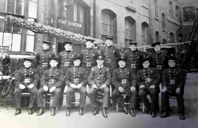 Firefighters from the Peek Frean Fire Brigade posed outside the fire station building at the Bermondsey site in 1938. The firefighters are wearing their uniforms